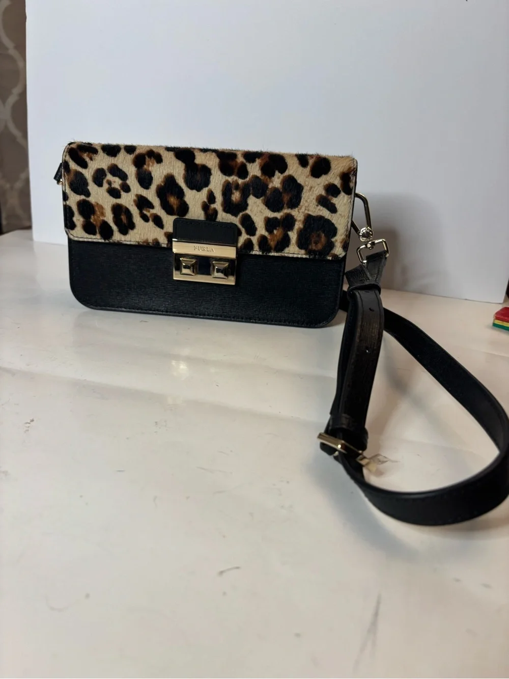 Furla Bella mini crossbody with leopard print calf hair and leather. Adjustable